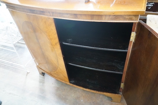 An Edwardian Sheraton revival satinwood banded mahogany bowfront two door side cabinet, width 106cm, depth 53cm, height 95cm